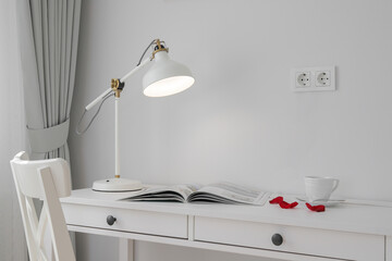 Glowing table lamp on the table