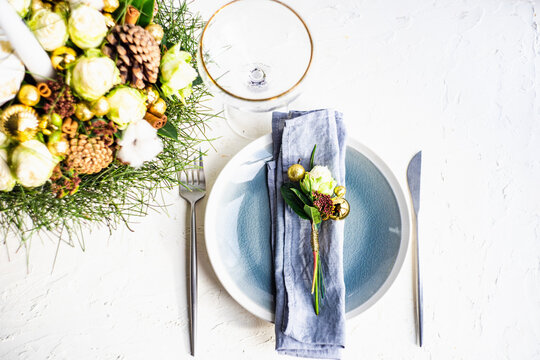 Place setting for festive Christmas dinner with beautiful dinnerware