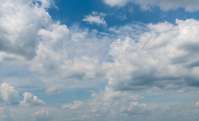 Cumulus clouds on the blue sky as a natural background.