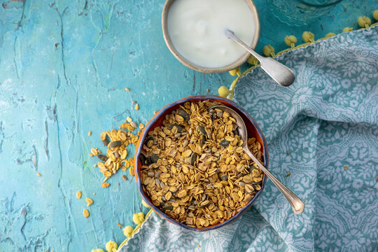 Oatmeal with pumpkin and sunflower seeds served with yoghurt