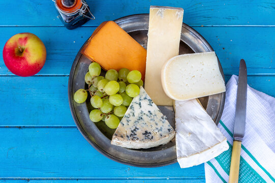 selection of cheeses with grapes