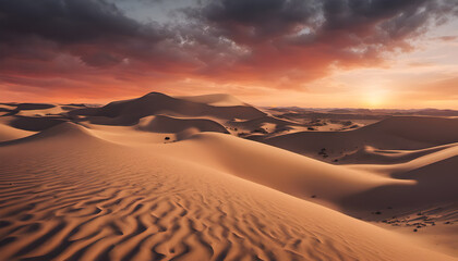 Fiery desert sunset over rolling sand dunes