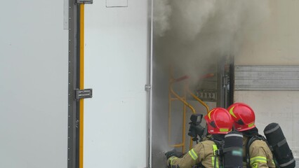 Firefighters Stopping a Fire in Delivery Truck With Lots of Smoke