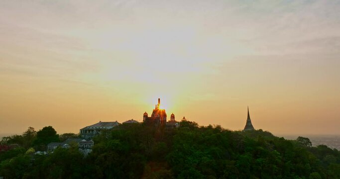 aerial view The rays of the sun shine on the top of the castle..The rays of the yellow sun pierced through the palace..Bright sky in the morning sun above the hilltop palace..Phetchaburi city 