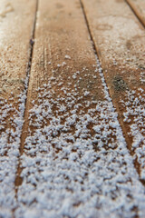 Boards are covered with snow.