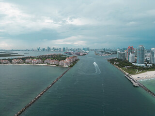 Fisher Island skyline with buildings seen from bay in South Beach. Miami Beach and Fisher Island aerial view. Luxury apartments on Fisher Island. Fisher Island from South Point Park Miami.