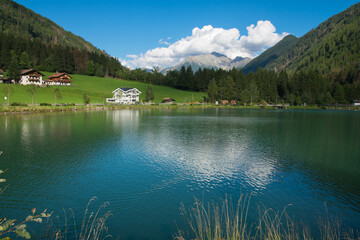 Summer view of beautiful alpine lake in Alto Adige, Italy