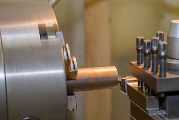 Close up scene the lathe machine rough cut  metal tube parts.