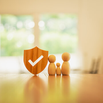 Shield protect icon and family model, Security protection and health insurance. The concept of family home, protection, health care day, car insurance.