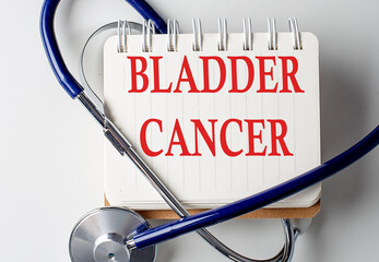 BLADDER CANCER word on notebook with medical equipment on background