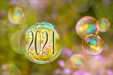 2024 on a soap bubble, holiday new year, green nature and lightness greeting card