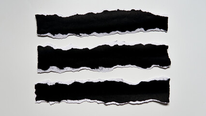 Torn black paper sheet isolated on white background - obrazy, fototapety, plakaty