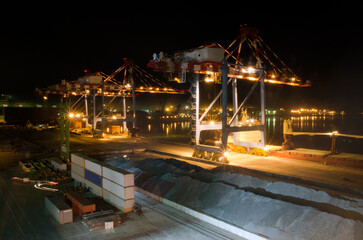 Container terminal. Sea port container terminal during work at night in fog