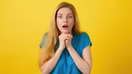Sadness, anger and worried stressed woman with excitement emotion. Upset sad lady in blue top screaming, closed eyes, cover ears for crisis stress or problem, studio isolated on yellow background