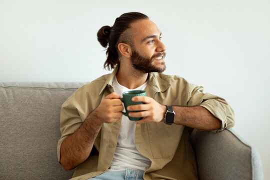 Portrait Of Cool Handsome Guy Hipster Drinking Coffee At Home