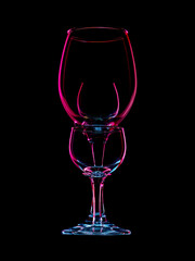 Colourful drinking glasses on black, dark field photography.