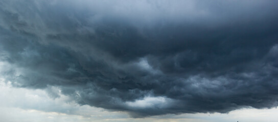 Bad or night weather sky and environment.The dark sky with heavy clouds converging and a hurricane...