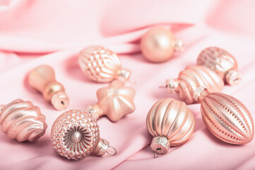 Festive Christmas background, Christmas card. Pink Christmas tree decorations on a pink background.Pink Christmas.
