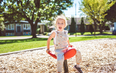 Happy kid on playground on summer season