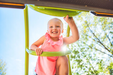 Happy kid on playground on summer season