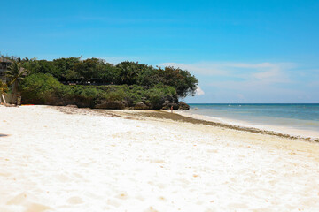 Beautiful beach with blue waters, white sand and clear sky at Alona Beach, Bohol, Philippines.