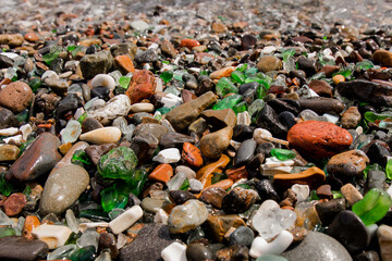 The texture of stones on a glass beach.