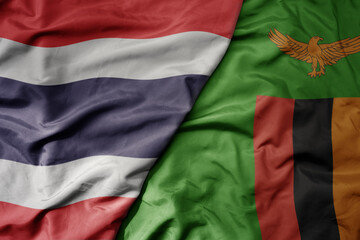 Obraz premium big waving national colorful flag of thailand and national flag of zambia .
