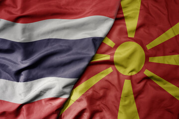 big waving national colorful flag of thailand and national flag of macedonia .