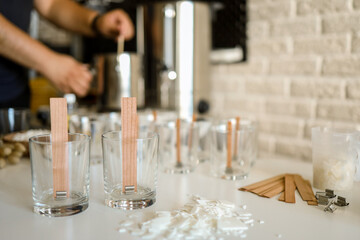 Master makes candles in the workshop