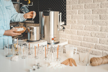 Master makes candles in the workshop