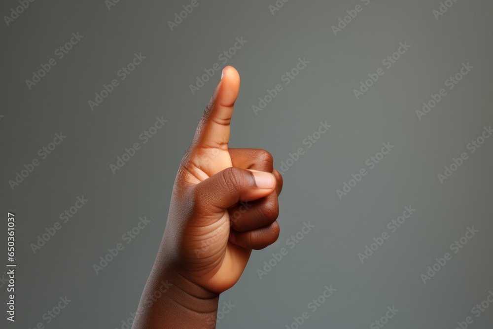 Aufkleber A close-up view of a hand with a finger pointing upwards. This image can be used to convey various concepts such as direction, instruction, guidance, or emphasis.