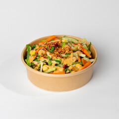 Green salad with corn, red beans and reddish noodles with white background