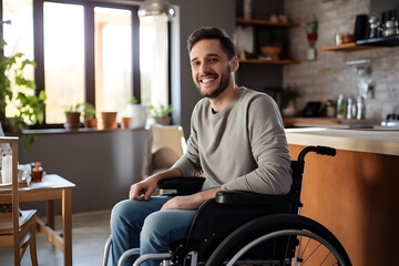 Naklejka premium Smiling young man sitting in wheelchair 