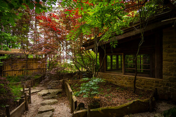 Japanese garden in spring with a stone path - 650367421
