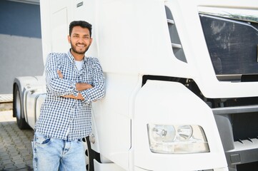 Portrait of confident indian truck driver on parking. Copy space.