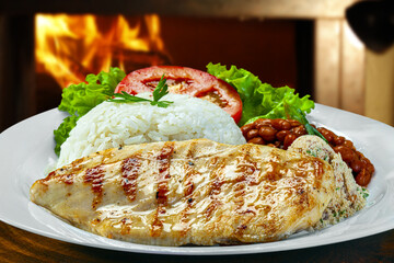 Rice beans grilled chicken steak salad, farofa