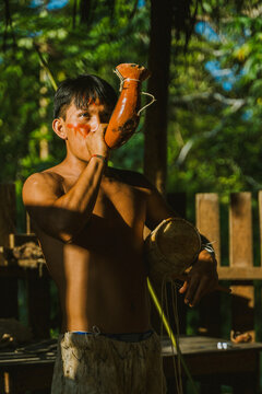 Tribal man with traditional horn in sunlight