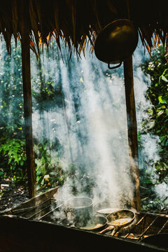 Frying pans and pot placed on grill