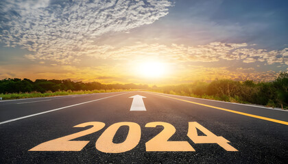 New year 2024 or straightforward concept. Text 2024 written on road in the middle of asphalt road at sunset. Concept of planning and challenge, business strategy, opportunity, hope, new life change