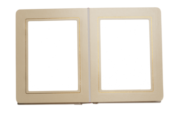 Open photo album in mother-of-pearl cover with gold border lines on pages, top view