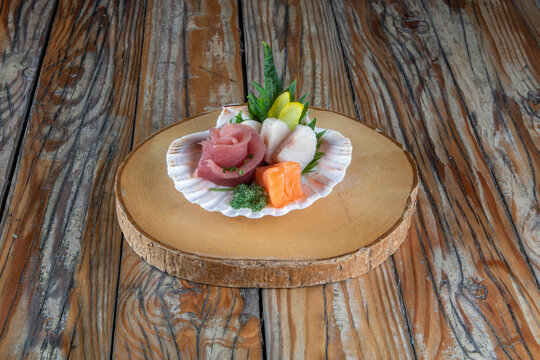 Seashell with raw fish assortment