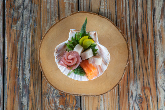 Seashell with raw fish assortment
