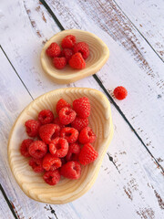 Fresh Raspberries in Wooden Bows