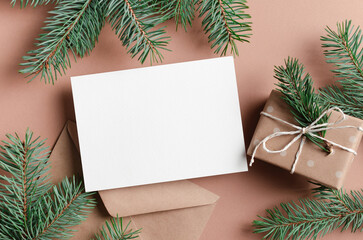 Blank New Year or Christmas greeting card mockup with holiday gift box, mock up with copy space