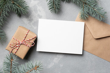 Fototapeta na wymiar Blank Christmas or New Year card mockup with gift box and envelope