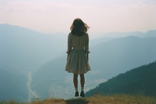 A woman from behind lavitating over ground