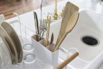 Clean dish in the rack in kitchen interior - obrazy, fototapety, plakaty
