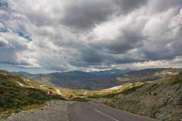 The road to the mountains under the clouds. Road Lagich - Pirkuli. Southern slopes of the Greater Caucasian Range. Azerbaijan nature.