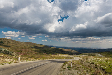 Road in the mountains under the clouds. Road Lagich - Pirkuli. Southern slopes of the Greater Caucasian Range. Azerbaijan nature.