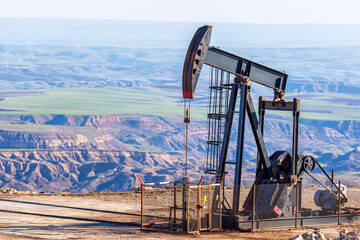 View of the pumpjack in the oil well of the oil field. Arrangement is commonly used for onshore...